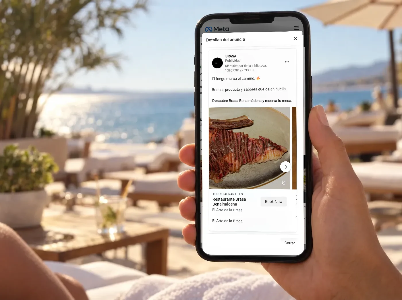 Móvil con el anuncio de un restaurante de Benalmádena en la Biblioteca de anuncios de Meta